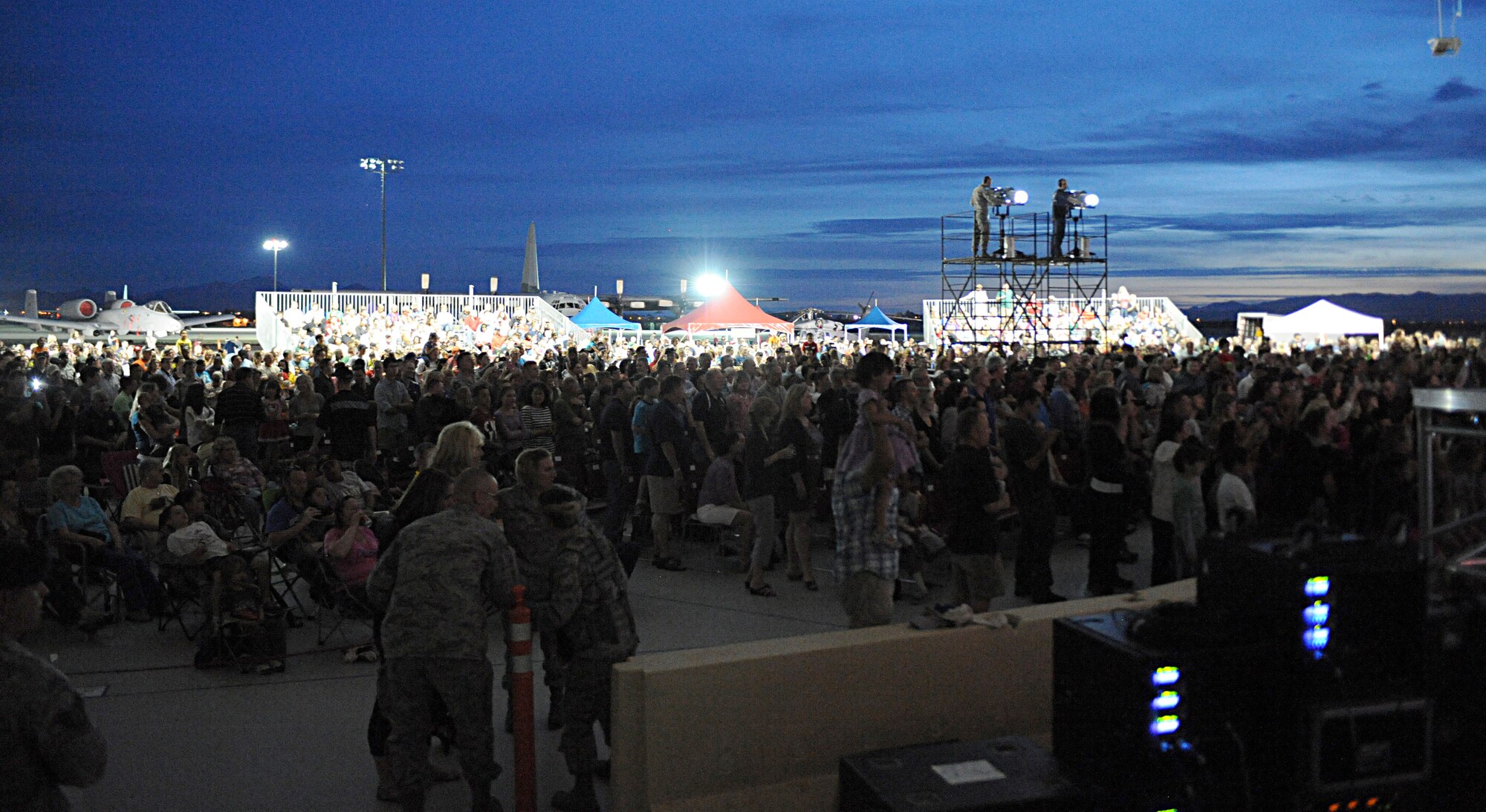 Members of the Desert Lightning Team watch the Lt. Dan Band perform at Davis-Monthan Air Force Base, Ariz., March 29, 2013. Approximately 2,500 people attended the free show. (U.S. Air Force photo by Senior Airman Timothy Moore/Relased)