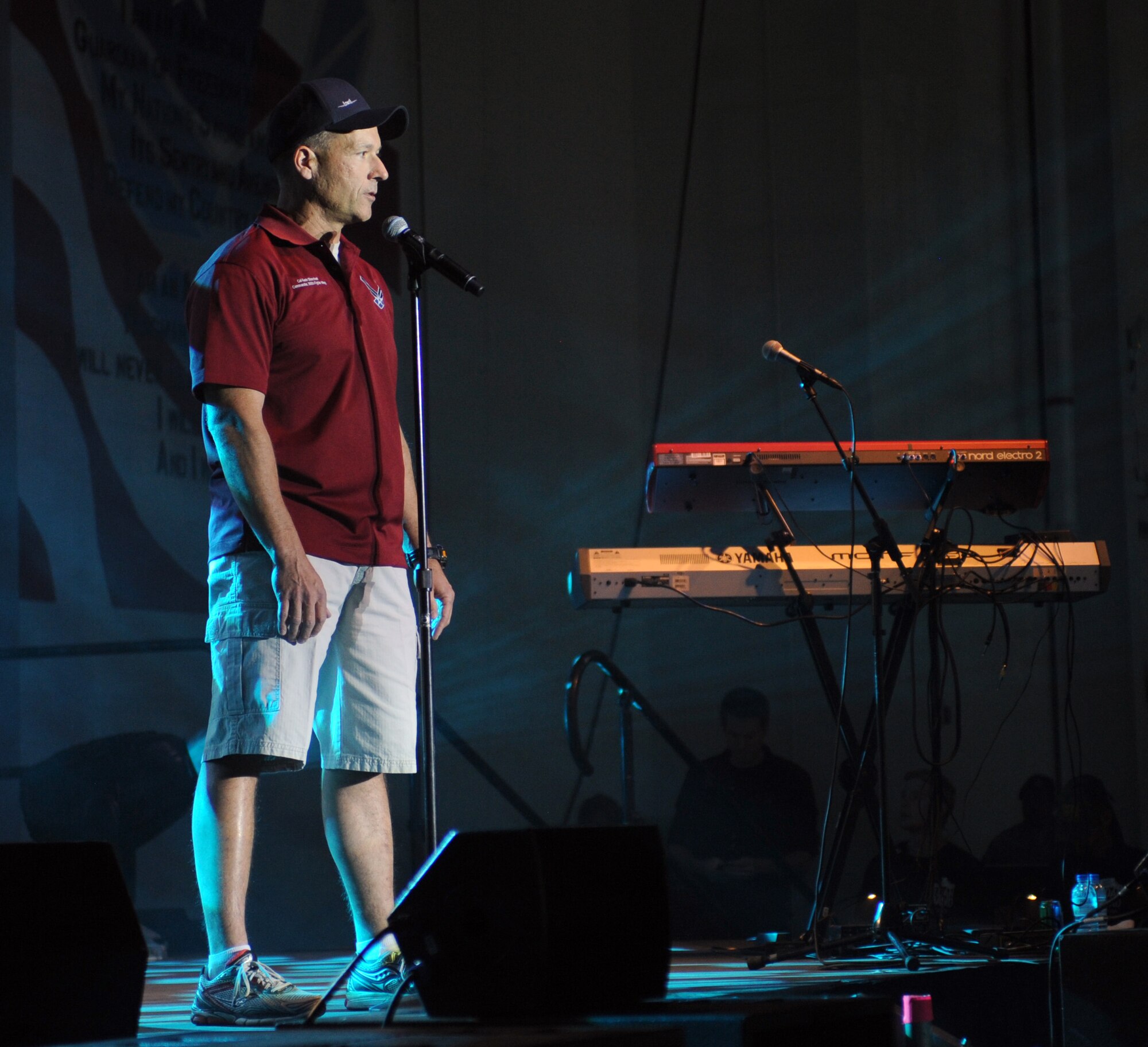 U.S. Air Force Col. Kevin Blanchard, 355th Fighter Wing commander, introduces the Lt. Dan Band at Davis-Monthan Air Force Base, Ariz., March 29, 2013. The band performed for members of the Desert Lightning Team, Tucson VA Hospital and their families as part of a free USO show. (U.S. Air Force photo by Senior Airman Timothy Moore/Relased)