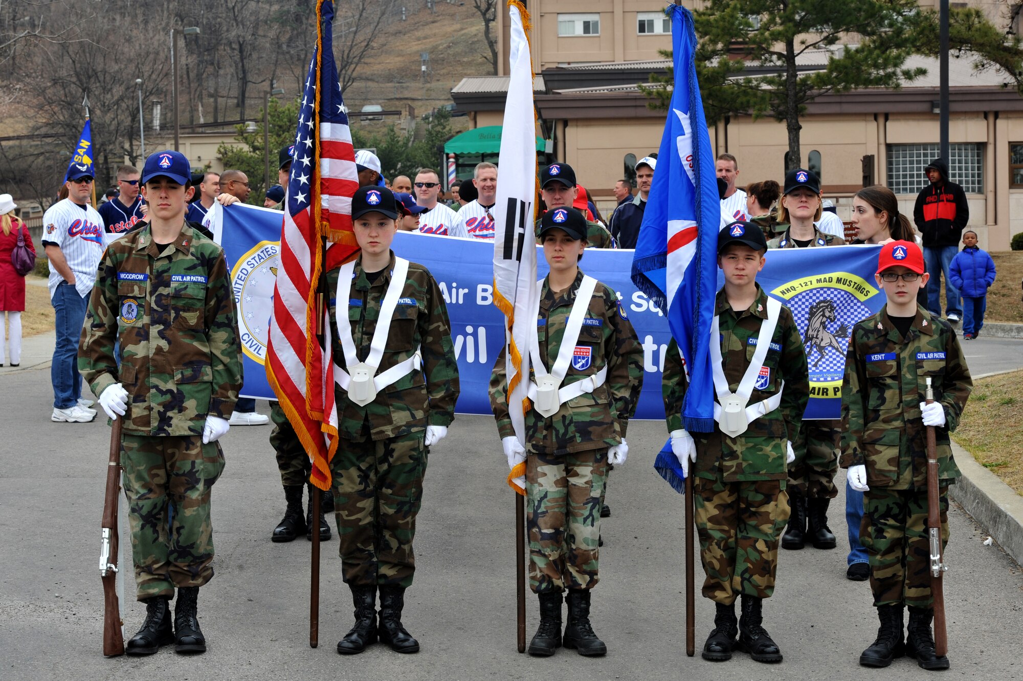 Base Civil Air Patrol cadets prepare to lead the Child Abuse Prevention Month Parade on Osan Air Base, Republic of Korea,  March 30, 2013. The parade started at the officers’ club and finished at the Osan High School football field.  (U.S.  Air Force photo/Staff Sgt. Emerson Nuñez)