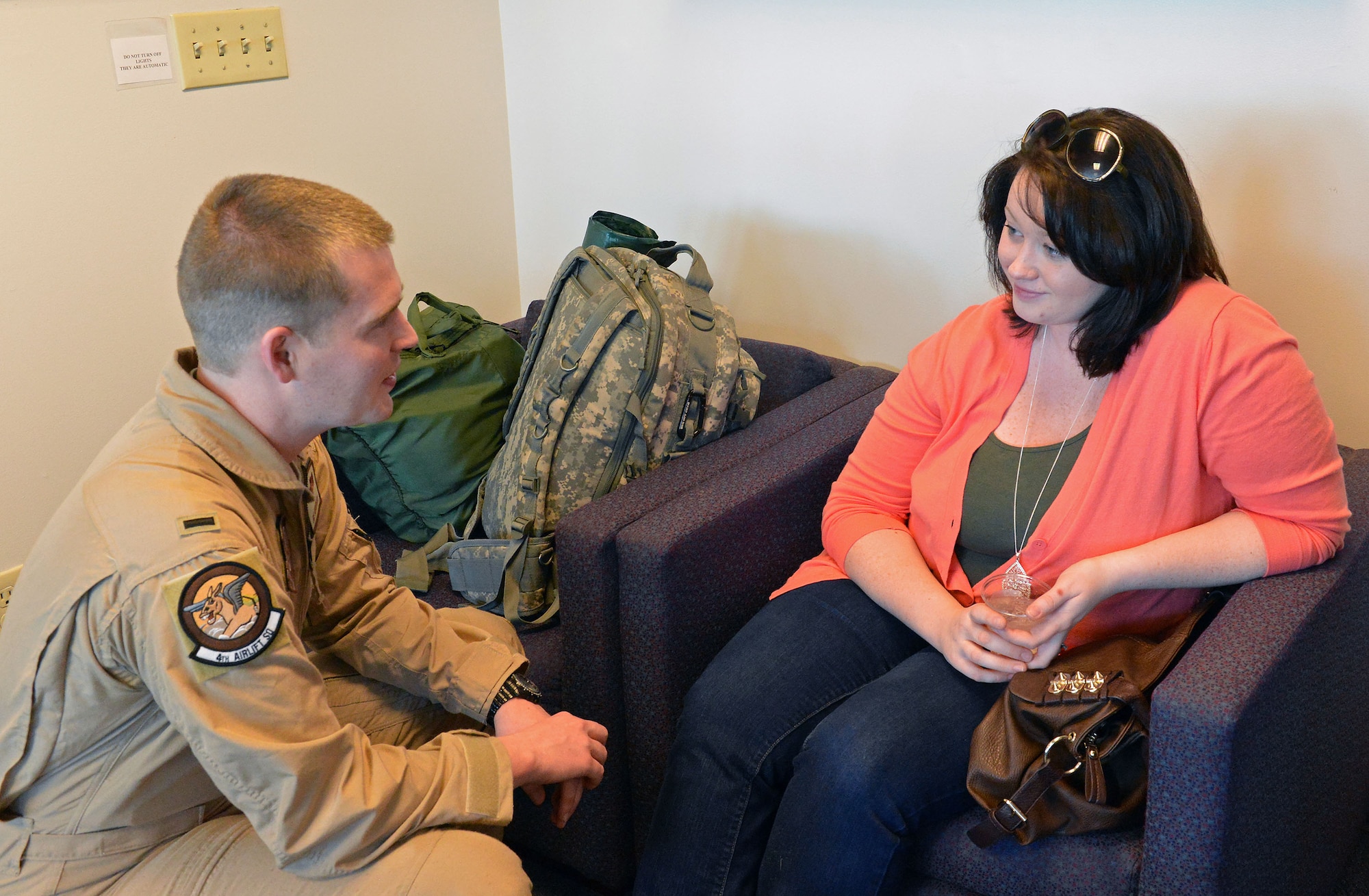 1st Lt. Joe Andersen, 4th Airlift Squadron pilot, says his goodbyes to his wife Amanda, as he prepares to depart Joint Base Lewis-McChord, Wash., March 31, 2013, before heading out for a 60-day deployment in support of Operation Enduring Freedom. The unit will operate out of two bases, managing and flying missions in and around Southwest Asia. They are replacing the 8th AS, which is scheduled to return in April. (U.S. Air Force photo/Airman 1st Class Jacob Jimenez)