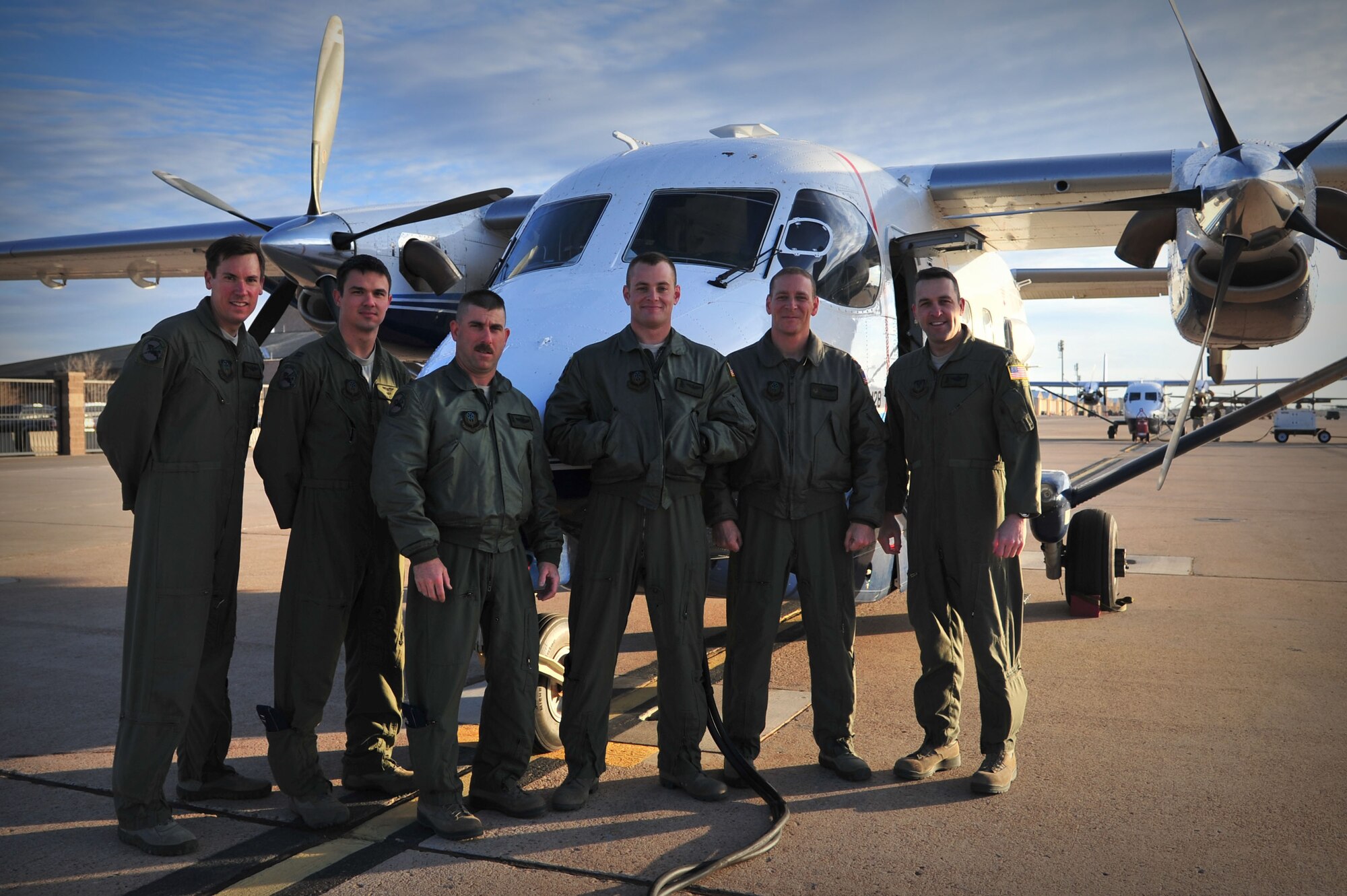 U.S. Air Force aircrew members with the 318th Special Operations Squadron prepare to board the last C-145As for the final local flight off the flightline at Cannon Air Force Base, N.M., March 28, 2013. The squadron’s C-145A aircraft will continue their mission under the vision and leadership of the 6th Special Operations Squadron at Duke Field, Fla. (U.S. Air Force photo/Senior Airman Alexxis Pons Abascal) 