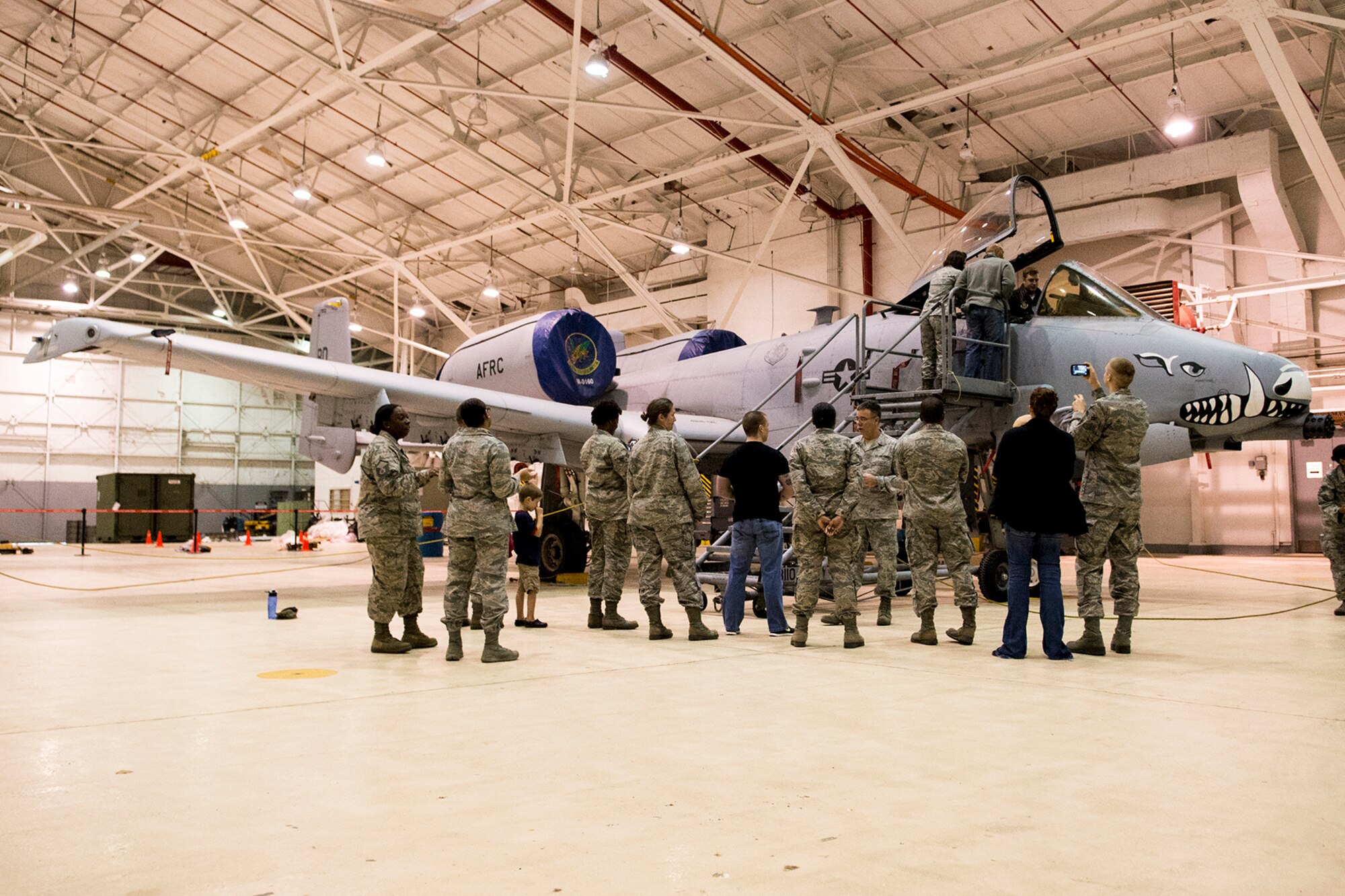 Personnel and family members from the 2nd Bomb Wing Office of the Staff Judge Advocate (JA), get a tour of a 917th Fighter Group A-10 Thunderbolt II, Mar. 29, 2013, Barksdale Air Force Base, La. The JA provides free legal services and advice to all active duty personnel and their dependents along with reservists and guardsman on federal active duty and their dependents. (U.S. Air Force photo by Master Sgt. Greg Steele/Released)