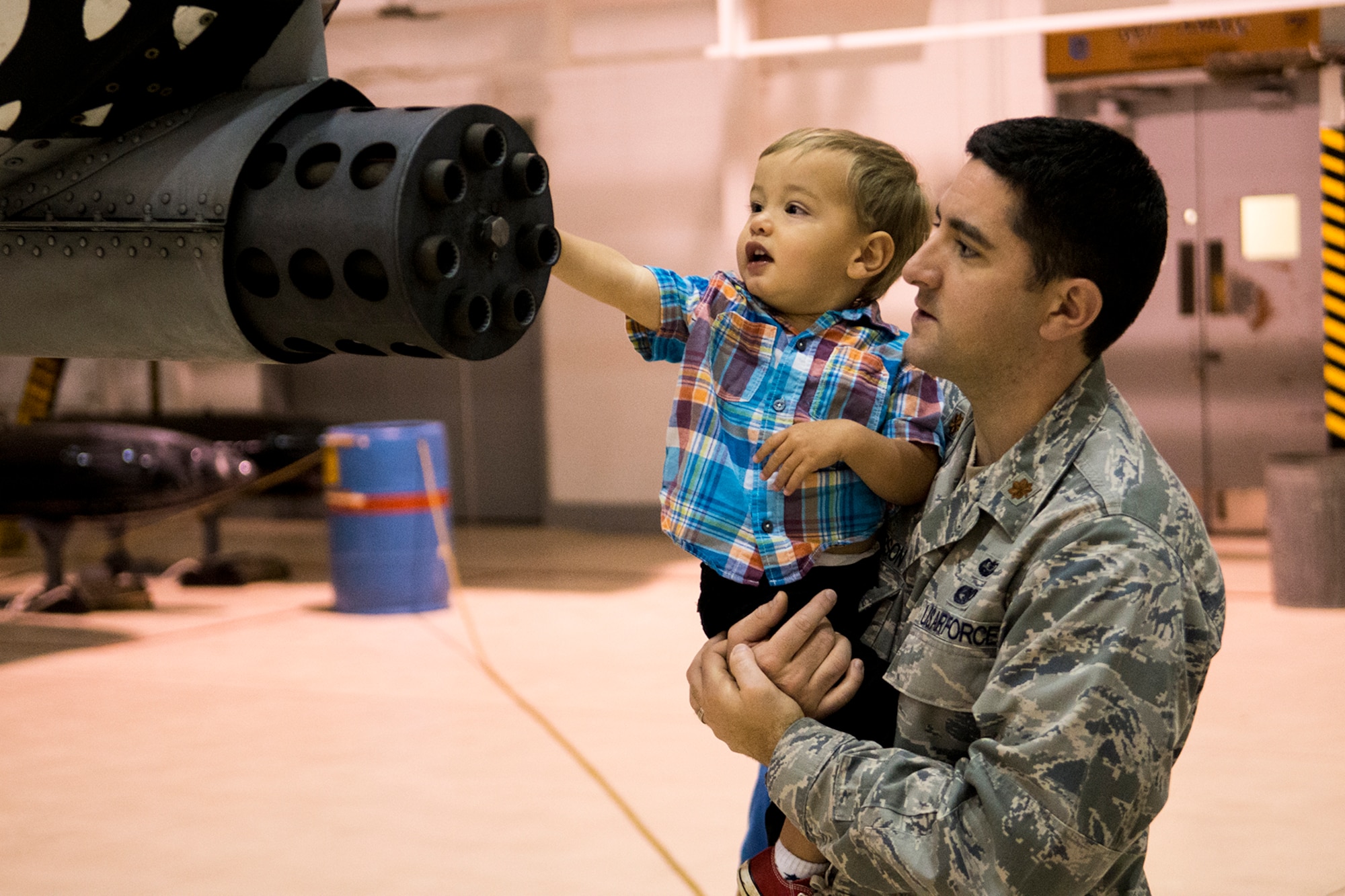 Benjamin, the son of U.S. Air Force Maj. Peter Anderson, reaches out to touch the gun muzzle of a 47th Fighter Squadron A-10 Thunderbolt II, Mar. 29, 2013, Barksdale Air Force Base, La. Anderson is assigned to the 2nd Bomb Wing's Office of the Staff Judge Advocate, and he and fellow co-workers received a tour of the A-10. (U.S. Air Force photo by Master Sgt. Greg Steele/Released)