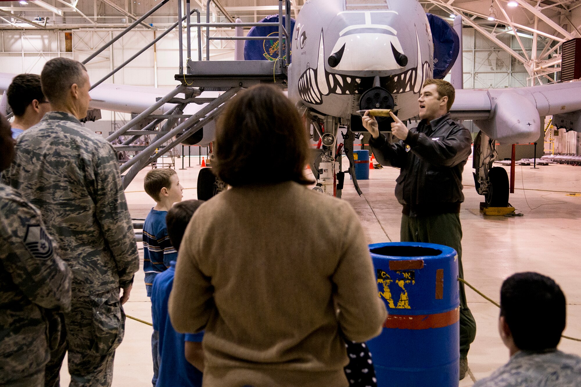 U.S. Air Force Capt. David Knighton, 47th Fighter Squadron pilot, talks to members from the 2nd Bomb Wing's Office of the Staff Judge Advocate (JA) about the mission and capabilities of the A-10 Thunderbolt II, Mar. 29, 2013, Barksdale Air Force Base, La. The JA provides high-quality legal advice and expertise in the areas of civil law, contract law, labor law, environmental law, claims and military justice for courts-martial and non-judicial punishment actions. (U.S. Air Force photo by Master Sgt. Greg Steele/Released)