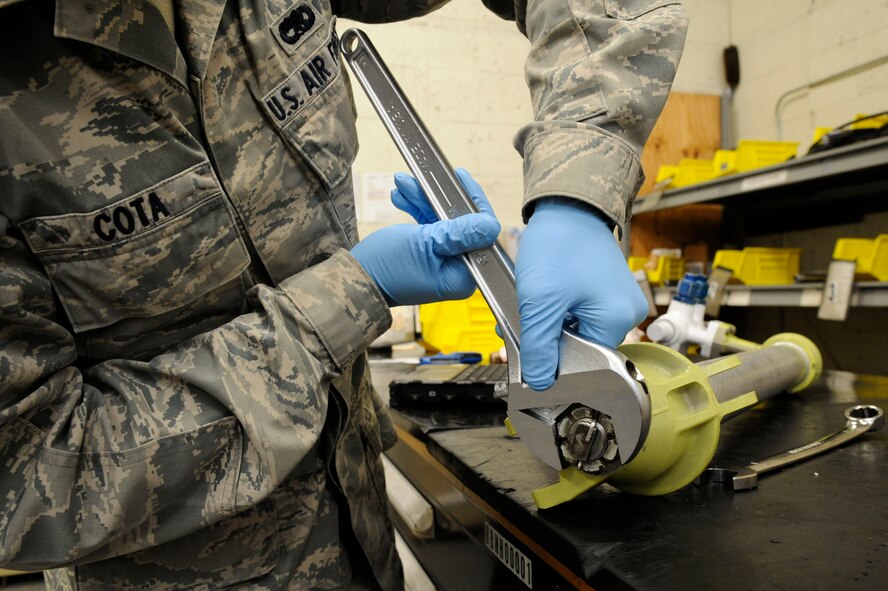 Senior Airman Richard Cota, 2nd Maintenance Squadron Accessories Flight Hydraulics, finishes assembling a bomb door actuator on Barksdale Air Force Base, La., April 1. Hydraulics Airmen's responsibilities include maintaining the hydraulic systems of the B-52H Stratofortress which allow the aircraft to steer, land and maneuver through the battlefield. (U.S. Air Force photo/Airman 1st Class Andrew Moua)