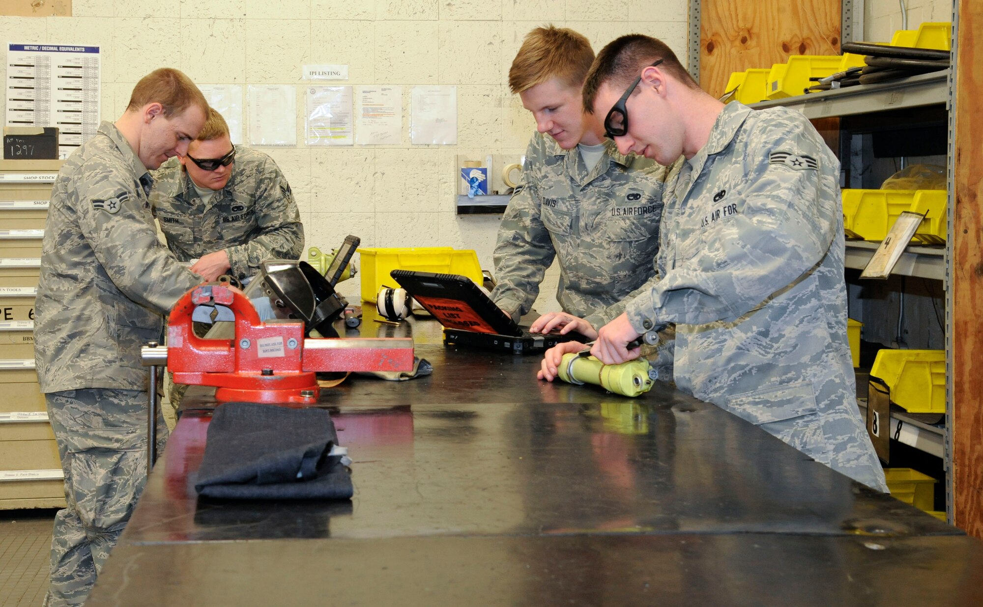 Airmen assigned to the 2nd Maintenance Squadron Accessories Flight Hydraulics section inspect and assemble hydraulic parts on Barksdale Air Force Base, La., April 1. Hydraulics Airmen's responsibilities include maintaining the hydraulic systems of the B-52H Stratofortress which allow the aircraft to steer, land and maneuver through the battlefield. (U.S. Air Force photo/Airman 1st Class Andrew Moua)