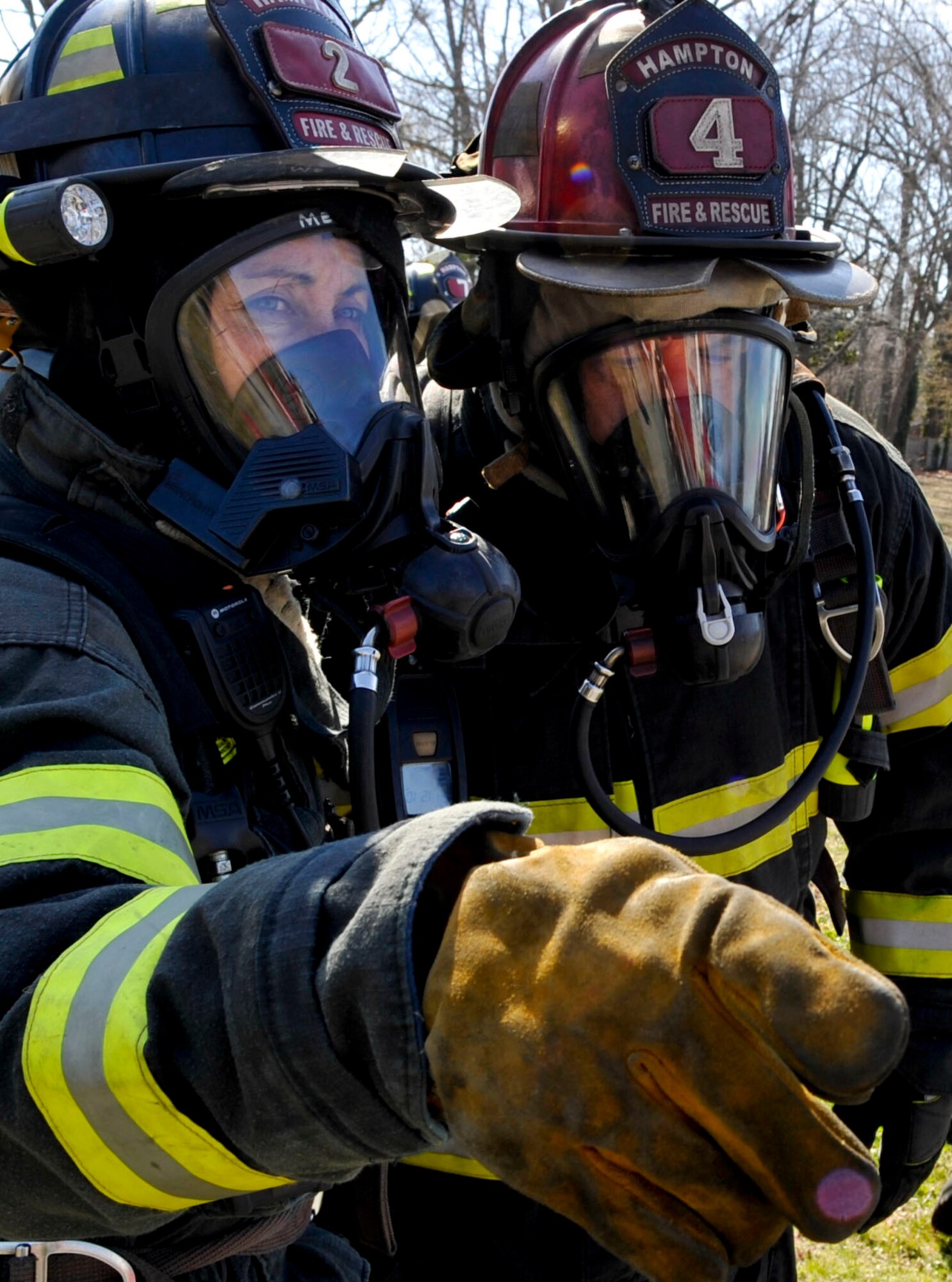 Firefighters with the city of Hampton respond during an F-22 Raptor crash exercise conducted by the city and Langley Air Force Base, March 28, 2013. The exercise allowed emergency responders from Hampton and Langley to work together and solidify their plan if such an event should occur. (U.S. Air Force photo by Staff Sgt. Wesley Farnsworth/Released)