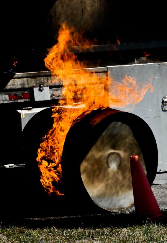 A wheel on an F-22 Raptor simulator burns at Gosnold’s Hope Park in Hampton, Va., during a crash exercise conducted by the city of Hampton and Langley Air Force Base, March 28, 2013. The exercise allowed emergency responders from Hampton and Langley to work together and solidify their plan if such an event should occur. (U.S. Air Force photo by Staff Sgt. Wesley Farnsworth/Released)
