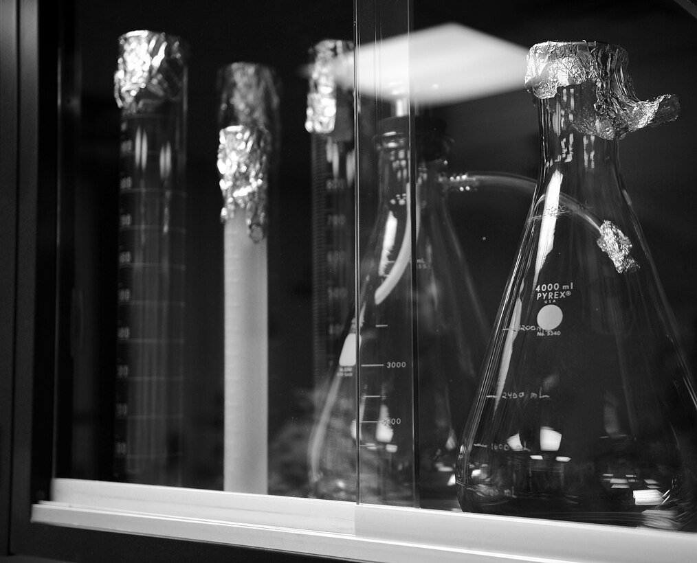 Beakers and other tools are used to obtain accurate measurements while testing fuel. The Langley Air Force Base fuels laboratory tests fuel multiple times throughout the fuel cycle for quality assurance. (U.S. Air Force photo by Senior Airman Brittany Paerschke-O’Brien/Released)