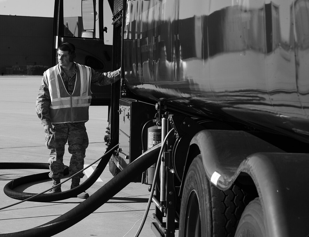 Airman 1st Class John Pisano, 633rd Logistics Readiness Squadron fuels distribution operator, prepares an R-11 fuel truck for a hot-refuel operation at Langley Air Force Base, Va., Mar. 14, 2013.  Hot-refuels are when a jet is refueled while still running, allowing the jet to get back in the air quickly. (U.S. Air Force photo by Senior Airman Brittany Paerschke-O’Brien/Released)