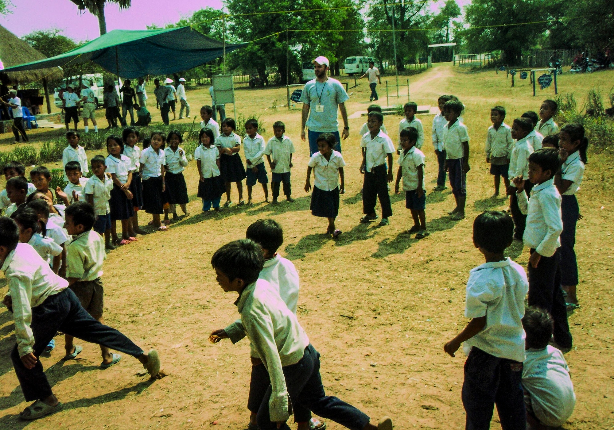 1st Lt. Joey Brewer, 16th Airlift Squadron pilot from Joint Base Charleston, gathers children to be seen for a medical check-up during a two-week trip to Cambodia, March 1 – 15, 2013, in support of Vets with a Mission, a not-for-profit agency that conducts humanitarian missions in Vietnam and Cambodia. (Courtesy photo)