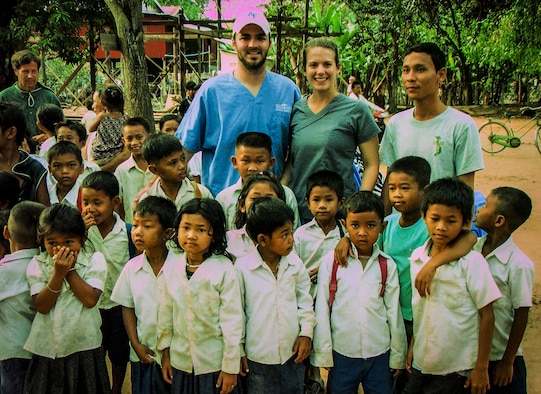 1st Lt. Joey Brewer, 16th Airlift Squadron pilot from Joint Base Charleston and his wife, Tori Brewer, pose with children during a two-week trip to Cambodia, March 1 – 15, 2013, in support of Vets with a Mission, a not-for-profit agency that conducts humanitarian missions in Vietnam and Cambodia. (Courtesy photo)