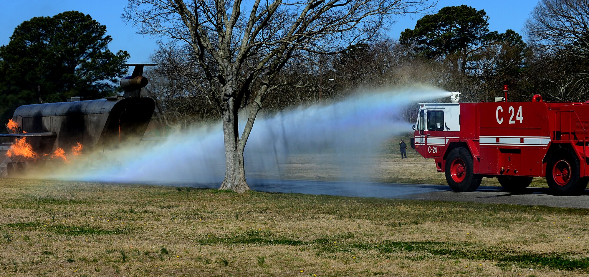 The Langley Air Force Base, Va., fire department responds to a simulated F-22 Raptor crash in Hampton’s Gosnold Hope Park, March 28, 2013. The exercise was designed to help the city and Langley Air Force Base first responders work more effectively together in the event of a real-world emergency. (U.S. Air Force photo by Senior Airman Kayla Newman/Released)