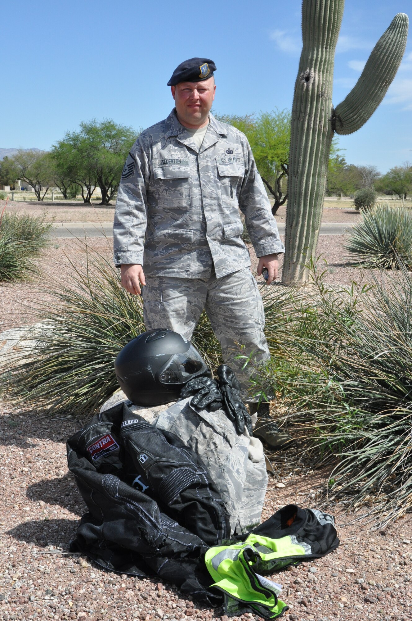 Master Sgt. David Alderton, 12th Air Force (Air Forces Southern) Force Protection, stands next to the motorcycle personal protective equipment that saved his life during a near fatal motorcycle accident on interstate 19 in Tucson, Ariz., March 27. (USAF photo by Master Sgt. Kelly Ogden/Released). 