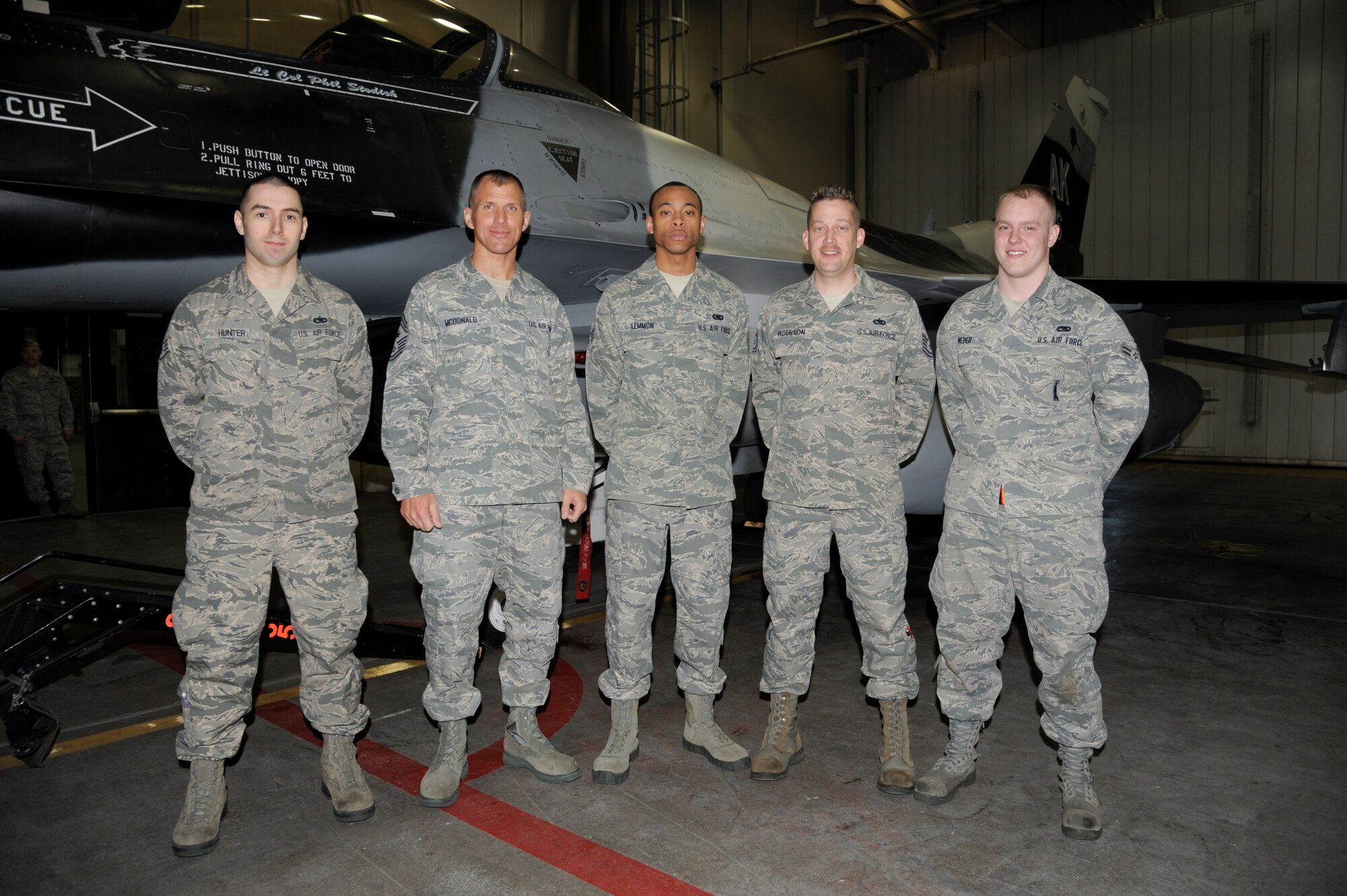Chief Master Sgt. Steve McDonald, Pacific Air Forces command chief master sergeant, poses for a photo with 354th Aircraft Maintenance Squadron members March 21, 2013, Eielson Air Force Base, Alaska. McDonald toured Eielson for the first time as the newest PACAF command chief. (U.S. Air Force Photo/Airman 1st Class Peter Reft)