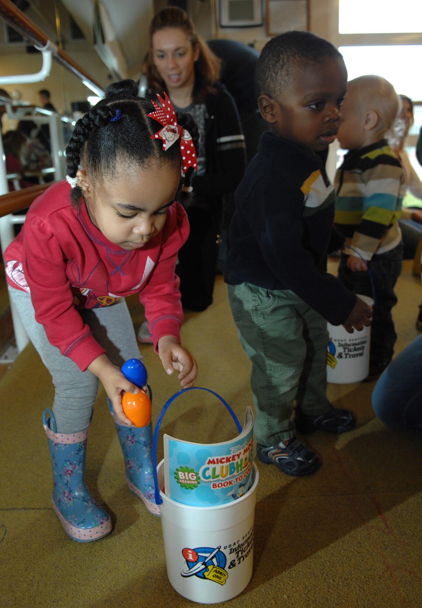 Team Mildenhall children, all under 3 years old, participate in an Easter egg hunt March 30, 2013, at the RAF Mildenhall Youth Programs center, England. The event attracted more than 160 children of all ages. (U.S. Air Force photo by Airman 1st Class Dillon Johnston/Released)