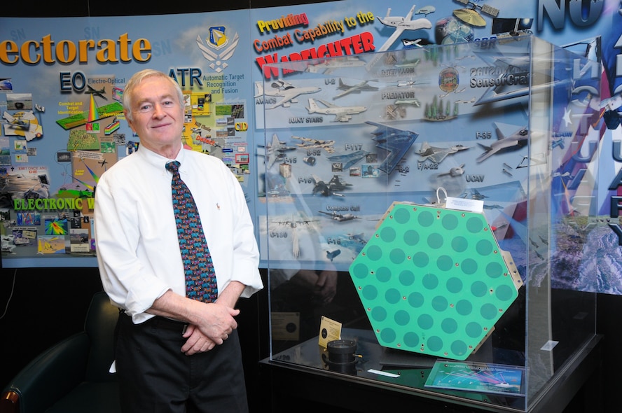 Dr. Boris Tomasic, Air Force Research Laboratory principal/senior electronics engineer, Sensors Directorate, Electromagnetics Technology Division, Antenna Technology Branch, poses with a subarray-basic building block of the Geodesic Dome Phased Array Antenna he designed and for which he was given the Department of Defense Distinguished Civilian Service Award. (U.S. Air Force photo/Niki Jahns) 