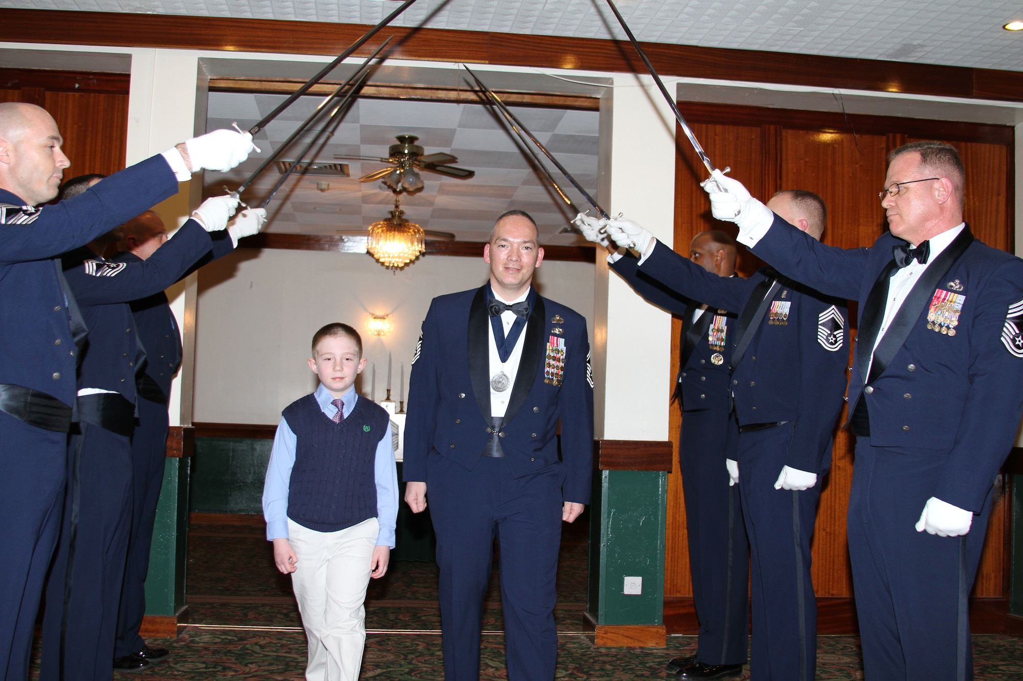 RAF LAKENHEATH, United Kingdom – (left to right ) Chief Master Sgt. Scott Berge, 501st Combat Support Wing command chief, Chief Master Sgt. Michael Brown, 423rd Communications Squadron superintendent, and Michelle Brown pose with retired Chief Master Sgt. of the Air Force Robert Gaylor, the fifth Chief Master Sergeant of the Air Force, during a Chief Master Sergeant Recognition Ceremony at RAF Lakenheath’s Eagles' Landing March 9. Retired Chief Master Sgt. of the Air Force Gaylor was the guest speaker of the ceremony. (Courtesy photo)