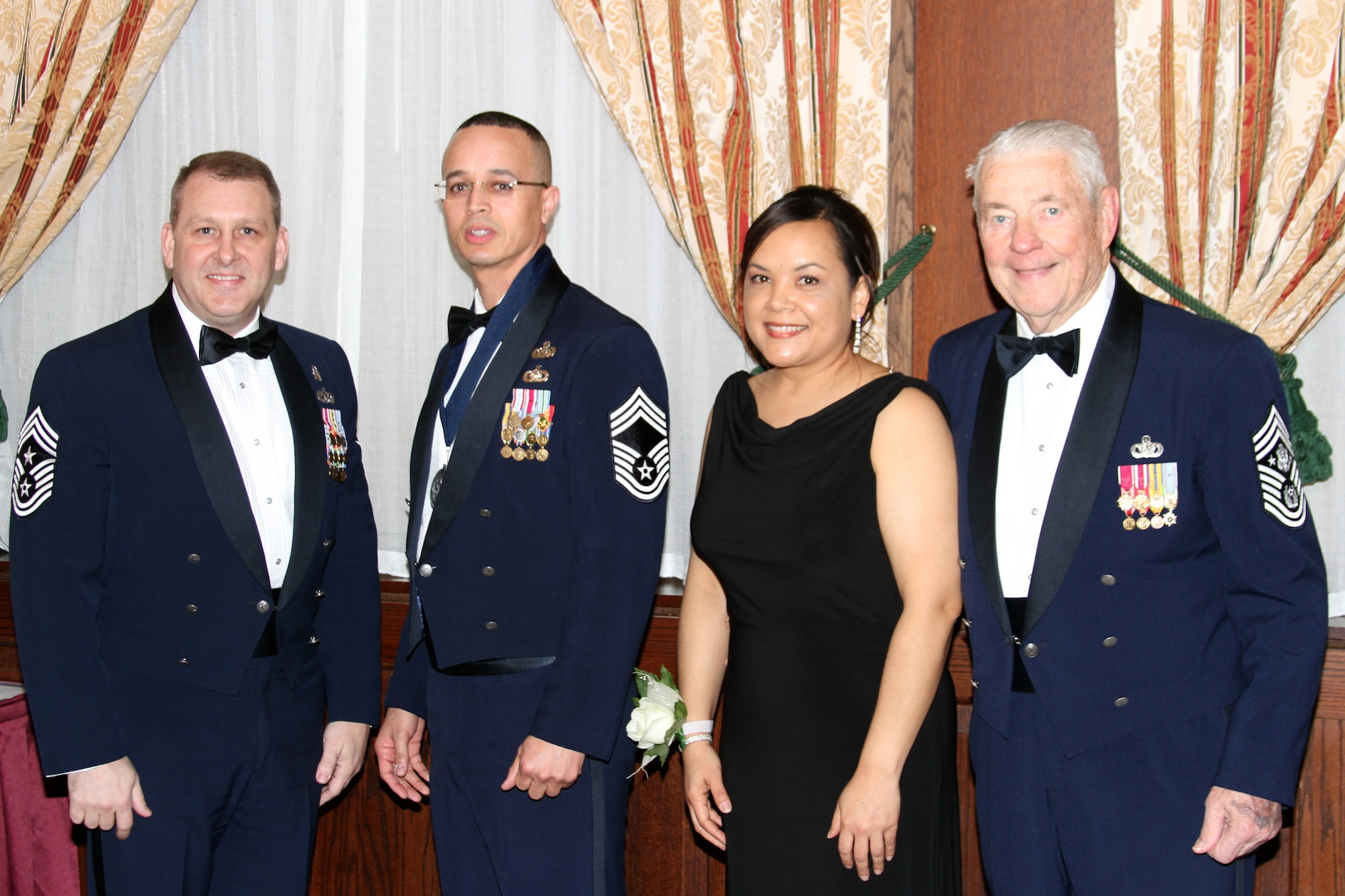 RAF LAKENHEATH, United Kingdom – (left to right ) Chief Master Sgt. Scott Berge, 501st Combat Support Wing command chief, Chief Master Sgt. Michael Brown, 423rd Communications Squadron superintendent, and Michelle Brown pose with retired Chief Master Sgt. of the Air Force Robert Gaylor, the fifth Chief Master Sergeant of the Air Force, during a Chief Master Sergeant Recognition Ceremony at RAF Lakenheath’s Eagles' Landing March 9. Retired Chief Master Sgt. of the Air Force Gaylor was the guest speaker of the ceremony. (Courtesy photo)
