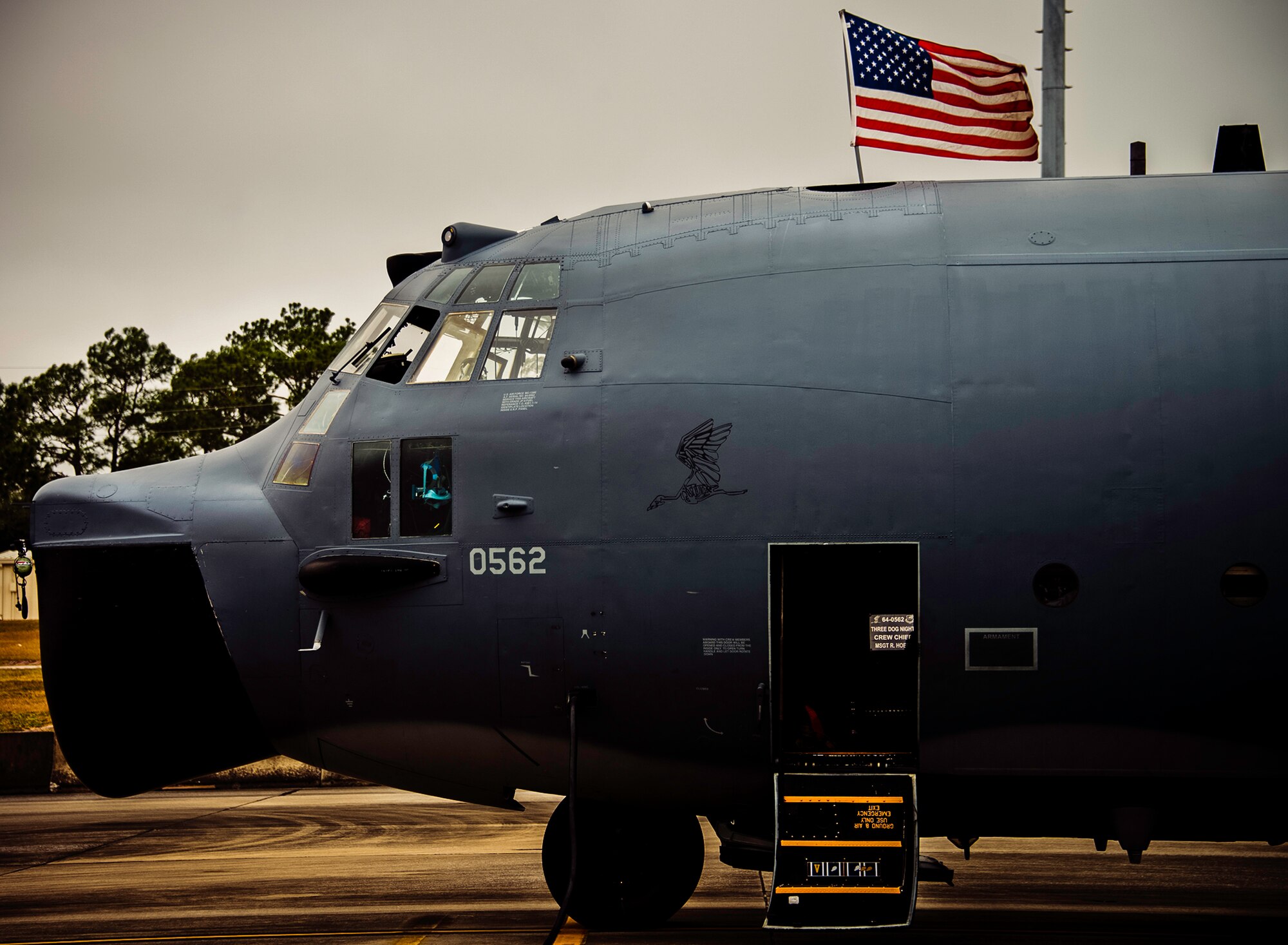 An American flag waves above an MC-130E Combat Talon I prior to a sortie at Duke Field, Fla. There are only five Talons left at the special operations reserve base. The 919th has begun remissioning to the Aviation Foreign Internal Defense aircraft, the C-145 Skytruck. (U.S. Air Force photo/Tech. Sgt. Samuel King Jr.)