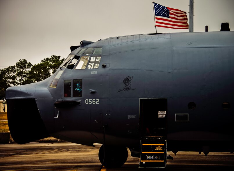 An American flag waves above an MC-130E Combat Talon I prior to a sortie at Duke Field, Fla. There are only five Talons left at the special operations reserve base. The 919th has begun remissioning to the Aviation Foreign Internal Defense aircraft, the C-145 Skytruck. (U.S. Air Force photo/Tech. Sgt. Samuel King Jr.)