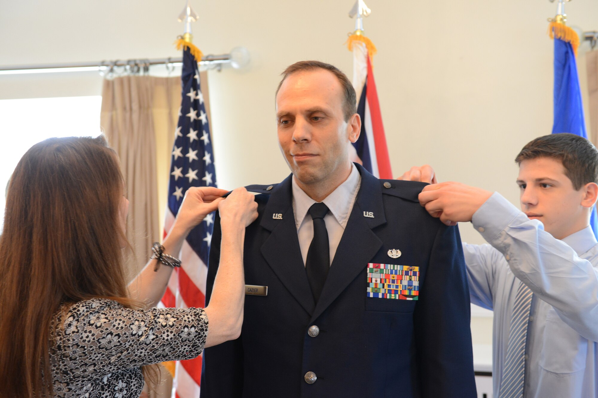 RAF ALCONBURY, United Kingdom – Lt. Col. David Cazier, 501st Combat Support Wing, gets his new rank pinned on during his promotion ceremony to March 29 at the Stukeley Inn on RAF Alconbury. (U.S. Air Force photo by Tech. Sgt. Chrissy Best)