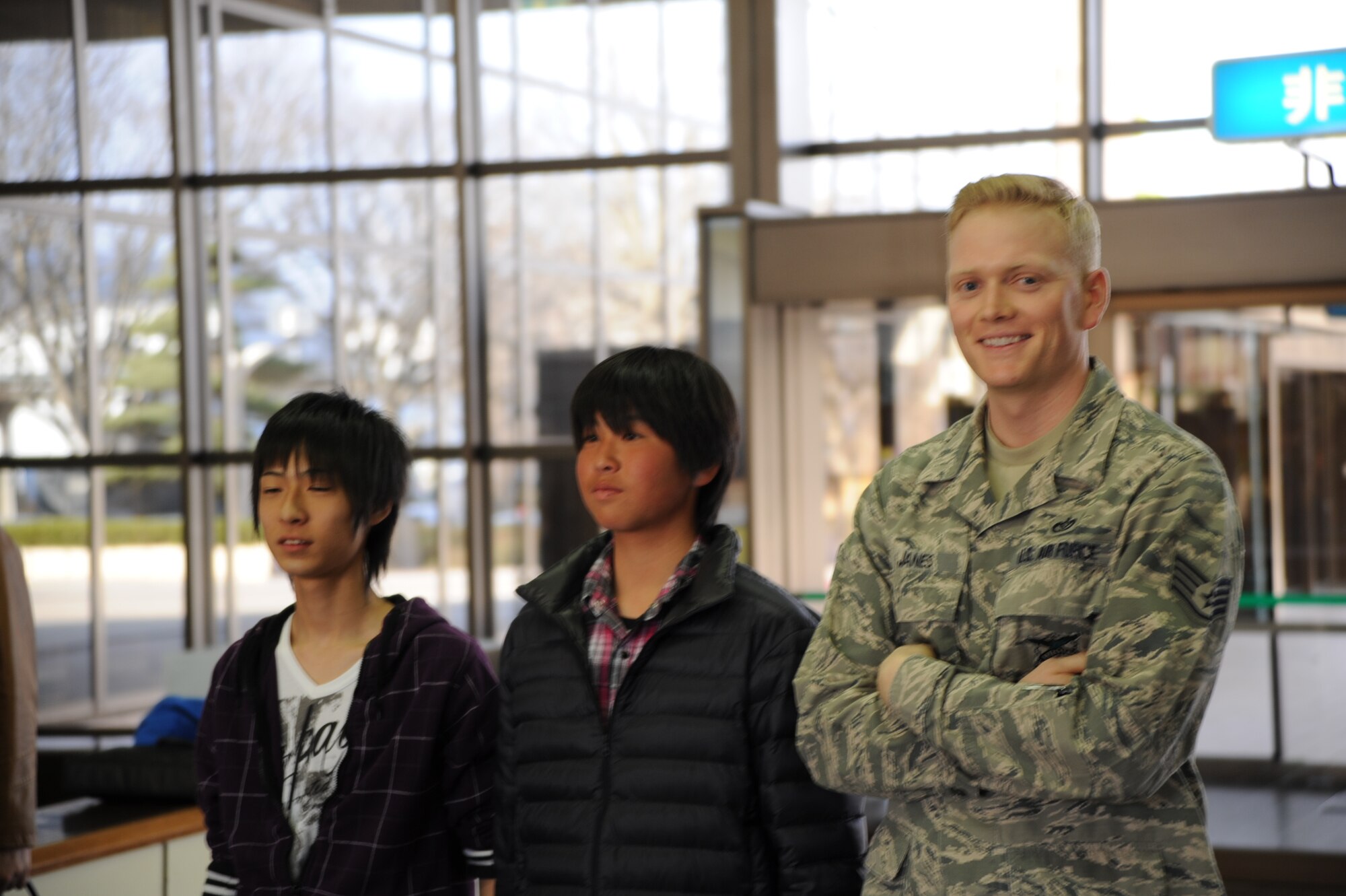U.S. Air Force Staff Sgt. Eric Janes, right, 35th Civil Engineer Squadron, stands with Homestay guests Yuto Suzuki, middle, and Yuya Fukushima, students from Taro Daiichi Junior High School, Miyako City, Japan, during an introduction ceremony at the Misawa City Civic Center, Misawa, Japan, March 29, 2013. Homestay is a program sponsored by the Misawa International Club where Japanese local nationals are invited to stay with Air Force families for a weekend to experience one another’s culture. The students traveled by train to Misawa Air Base from their school, which is located in the area where devastating earthquakes and tsunamis struck in 2011, which sparked the U.S. to launch Operation Tomodachi in an effort to rebuild the community. (U.S. Air Force photo by Senior Airman Derek VanHorn)
