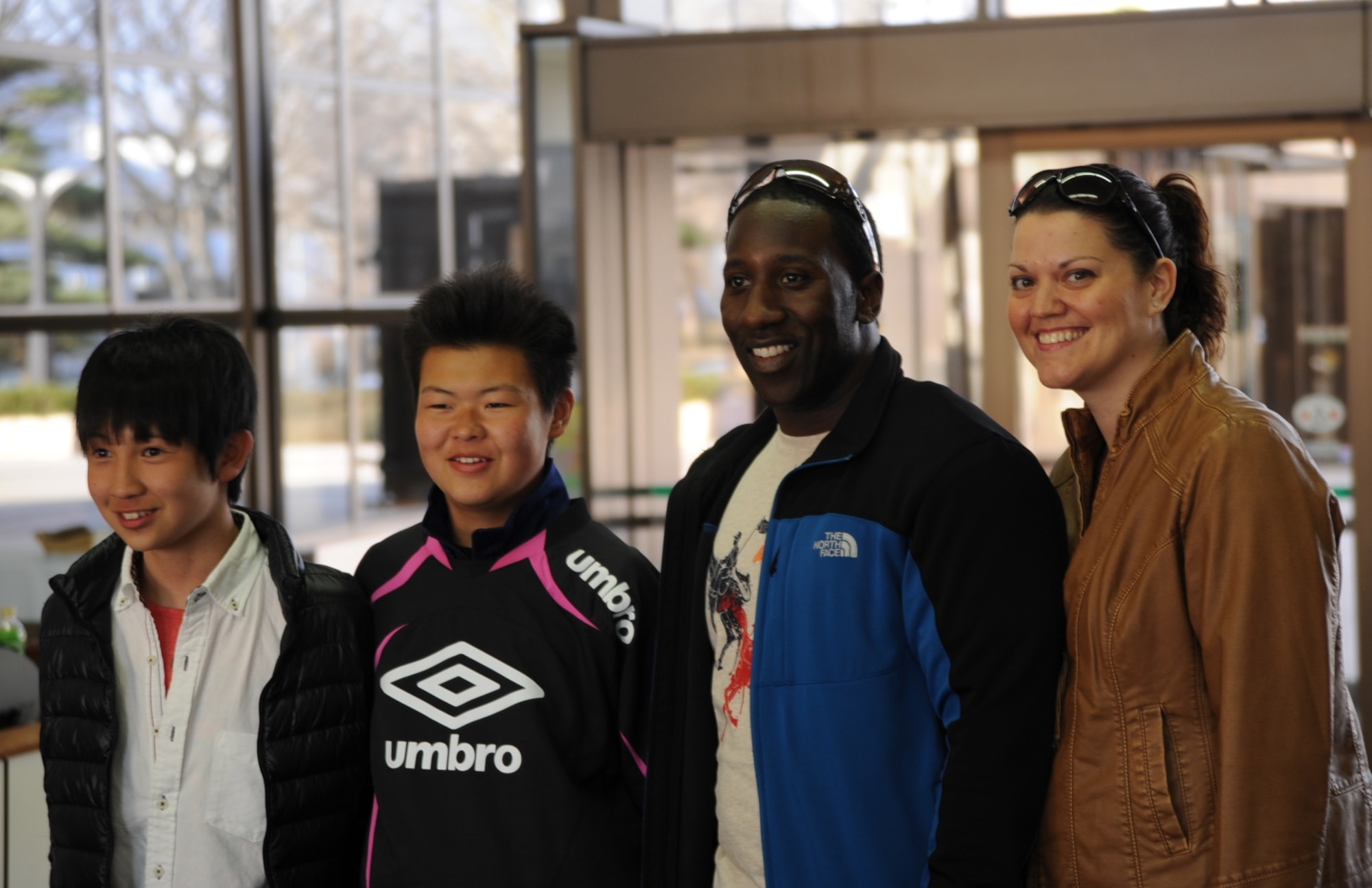 From left:  Ruka Mukaiguchi and Daiki Tamura, students from Taro Daiichi Junior High School, Miyako City, Japan, stand with U.S. Air Force Tech. Sgt. Chris Cauthen, 35th Operations Support Squadron, and his wife, Master Sgt. Jessica Cauthen 373rd Support Squadron, during an introduction ceremony at the Misawa City Civic Center, Misawa, Japan, March 29, 2013. The Cauthens welcomed the duo as part of Homestay, an event where Japanese students live with Air Force families for a weekend to share cultures and bolster relations. Homestay was hosted by the Misawa International Club, who continues their efforts to help people who live in areas impacted by the earthquake and in March 2011. (U.S. Air Force photo by Senior Airman Derek VanHorn)