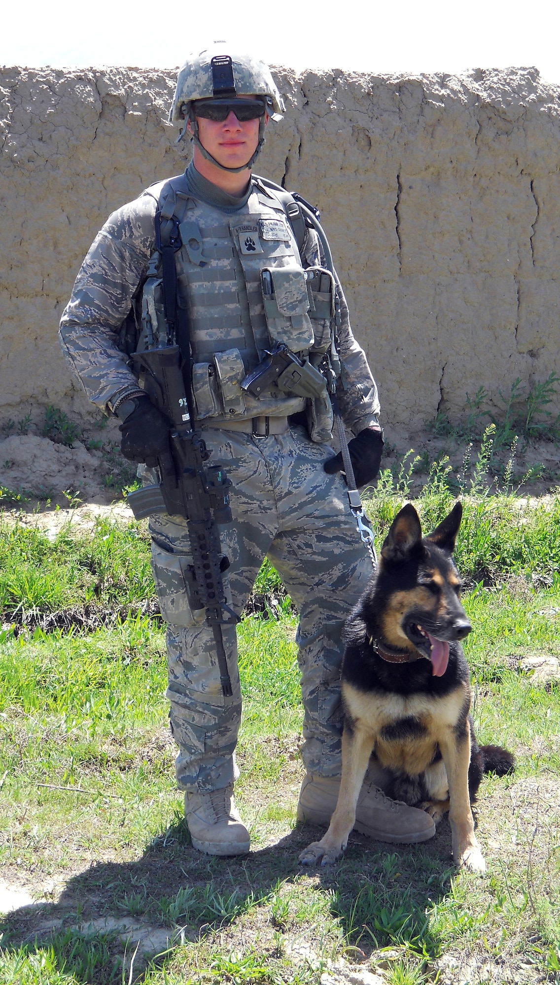 Staff Sgt. Benjamin Seekell and military working dog Charlie.  Both suffered severe injuries while on patrol in Afghanistan. (Submitted photo)