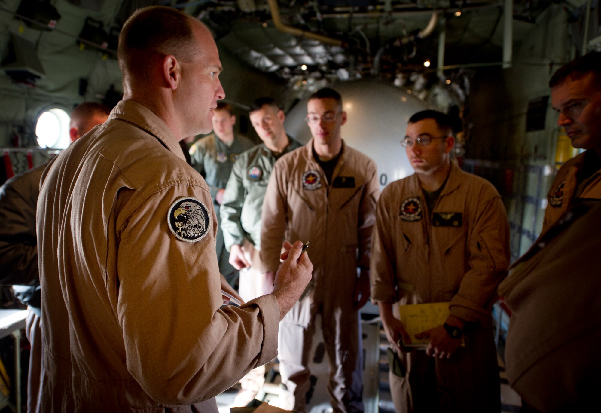 YOKOTA AIR BASE, Japan -- Marines with the Marine Aerial Refueler Transport Squadron 152th Training Squadron, 1st Marine Aircraft Wing, Iwakuni, Japan, receive a pre-flight briefing before takeoff March 26, 2013, at Yokota Air Base, Japan. The Marines worked alongside members from the 36th Airlift Squadron, doing controlled airspace training.(U.S. Air Force photo by Staff Sgt. Stacy Moless)