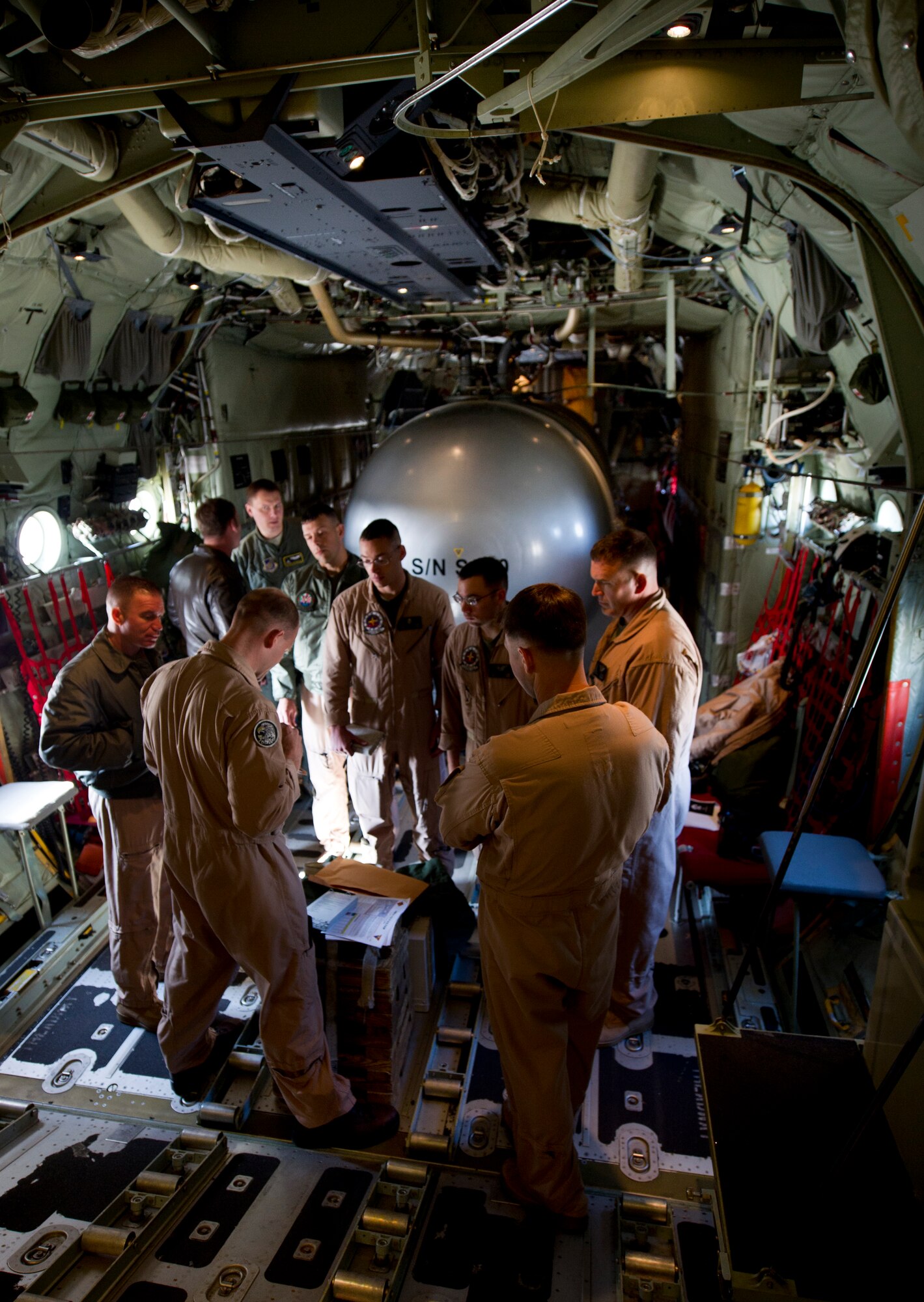 YOKOTA AIR BASE, Japan -- Marines with the Marine Aerial Refueler Transport Squadron 152th Training Squadron, 1st Marine Aircraft Wing, Iwakuni, Japan, receive a pre-flight briefing before takeoff March 26, 2013, at Yokota Air Base, Japan. The Marines worked alongside members from the 36th Airlift Squadron, doing controlled airspace training.(U.S. Air Force photo by Staff Sgt. Stacy Moless)