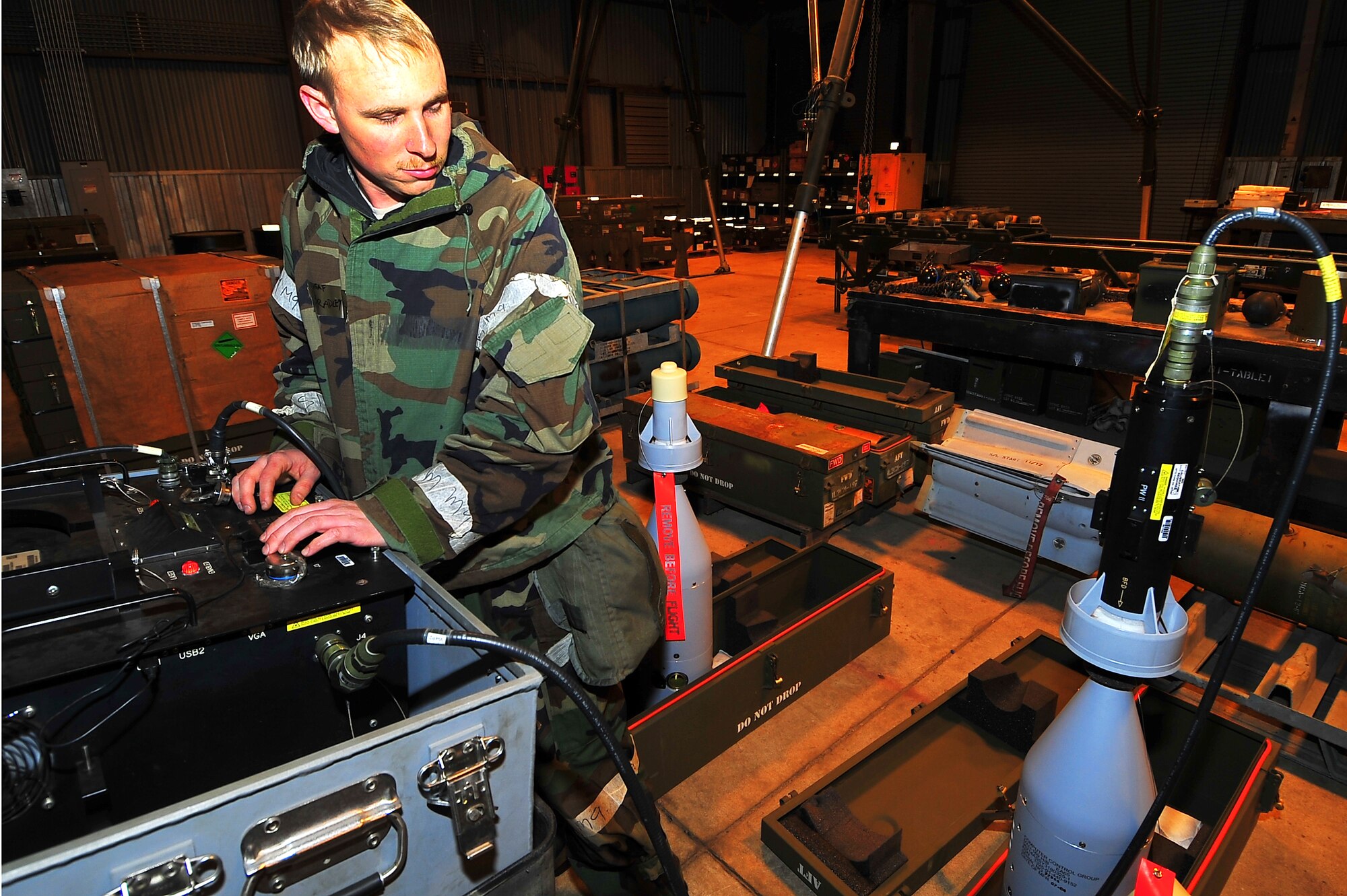 Airman 1st Class Bradley Meier, 51st Munitions Squadron flight line maintenance crew member, tests the computer control group type MAU-169 guidance system to ensure accuracy of bombs on target during Operational Readiness Exercise Beverly Midnight 13-02 at Osan Air Base, Republic of Korea, March 20, 2013.  The CCG was mounted onto a 500-pound bomb.  (U.S.  Air Force photo/Staff Sgt. Emerson Nuñez)