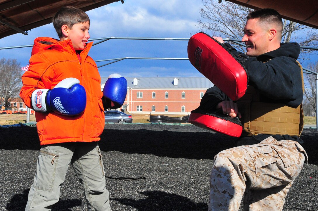 Tyler, 10, gets an opportunity to train with Sgt. Mark Green, a martial arts instructor trainer at the Martial Arts Center of Excellence, on March 28, 2013, during a family visit to The Basic School. Medal of Honor recipient 1st Lt. Baldomero Lopez, Tyler’s great uncle, will have a building on Quantico dedicated to him later this year. 