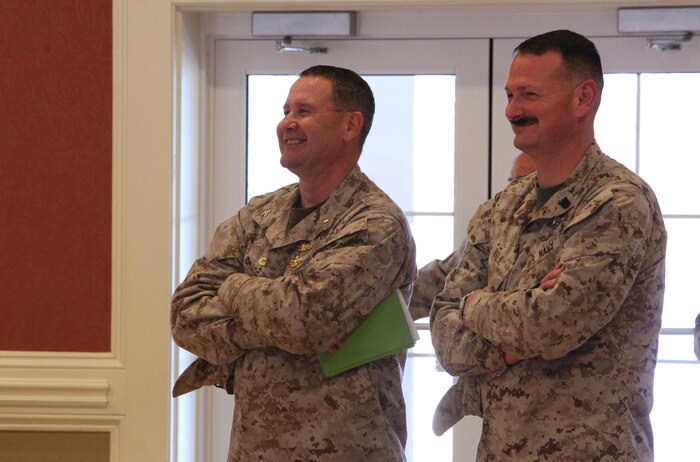 Navy Capt. Cameron L. Waggoner (left), the commanding officer and Master Chief Petty Officer Christopher L. Hill (right), the command master chief of  2nd Medical Battalion, Combat Logistics Regiment 25, 2nd Marine Logistics Group share a laugh during the battalion’s Women’s History Month event aboard Camp Lejeune, N.C., March 27, 2013. Marines and sailors with the unit spoke about famous female servicemembers, which included Brig. Gen. Margaret A. Brewer and Rear Adm. Grace Hopper.