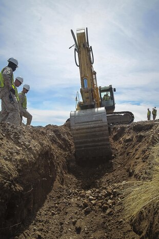 U.S. Marines assigned to Engineer Company, Marine Wing Support Squadron 272, Marine Corps Air Station New River, N.C., use an excavator to dig a trench for a new a culvert designed to protect a newly constructed border security road along the U.S./Mexico border, near Nogales, Ariz., Mar. 19.


