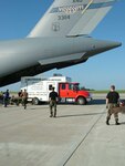 Members of the 172nd Airlift Wing in Jackson, Mississippi and the 190th Air Refueling Wing in Topeka, Kansas supply dunnage to load an emergency vehicle headed for the stranded miners in Utah on Thursday. The National Guard coordinated the emergency airlift mission which picked up the vehicle at Forbes Field in Kansas on Thursday.