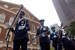 Senior Airman Jermain James (left) spins his rifle during a drill maneuver while performing with fellow members of the U.S. Air Force Honor Guard Drill Team at a proclamation ceremony for Air Force Week New England in front of historic Faneuil Hall in downtown Boston Aug. 17. The drill team is the traveling component of the Air Force Honor Guard and tours worldwide showcasing the precision of today's Air Force to recruit, retain and inspire Airmen.