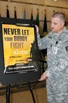 Master Sgt. Marshall Bradshaw, the Army National Guardâ€™s Suicide Prevention Program manager, posts a suicide prevention placard at the National Guard's joint headquarters at Jefferson Plaza One in Arlington, Va., on Aug. 17. Statistics reveal suicide is the third-leading cause of death among National Guard Soldiers.