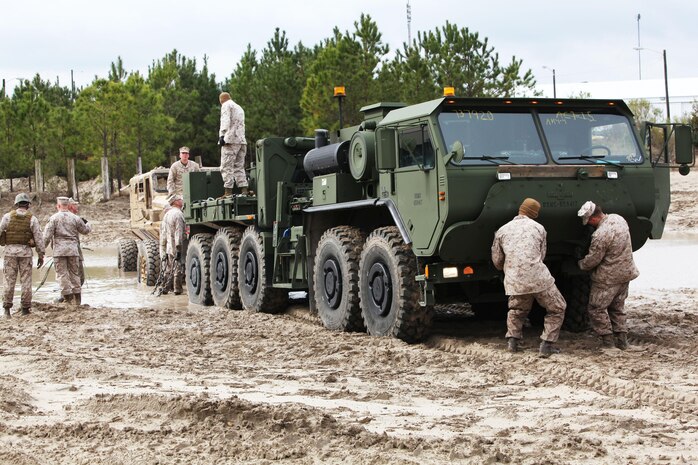 Marines from 2nd Maintenance Battalion, Combat Logistics Regiment 25, 2nd Marine Logistics Group attach a Logistics Vehicle System Replacement to pull out a Mine Resistant Ambush Protected vehicle during the Vehicle Recovery Course aboard Camp Lejeune, N.C., March 25, 2013.  A Marine Corps instructor came down from Fort Leonard Wood, Mo., teaching the Marines about vehicle recovery operations.