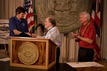 Hawaii Gov. Neil Abercrombie proclaims April as Tsunami Awareness Month at the state capitol building  April 1, 2013, with Dr. Gerald Fryer, senior geophysics at NOAA's Pacific Tsunami Warning Center and Mayor Kirk Caldwell. The Hawaii State Civil Defense, the mayor of the city and county of Honolulu, Department of Emergency Management and National Oceanographic and Atmospheric Administration's National Weather Service and representatives from the Department of Defense all took part in the proclamation which emphasizes the importance of tsunami awareness and preparedness for residents and visitors of Hawaii. (U.S. Air Force photo/Staff Sgt. Mike Meares)