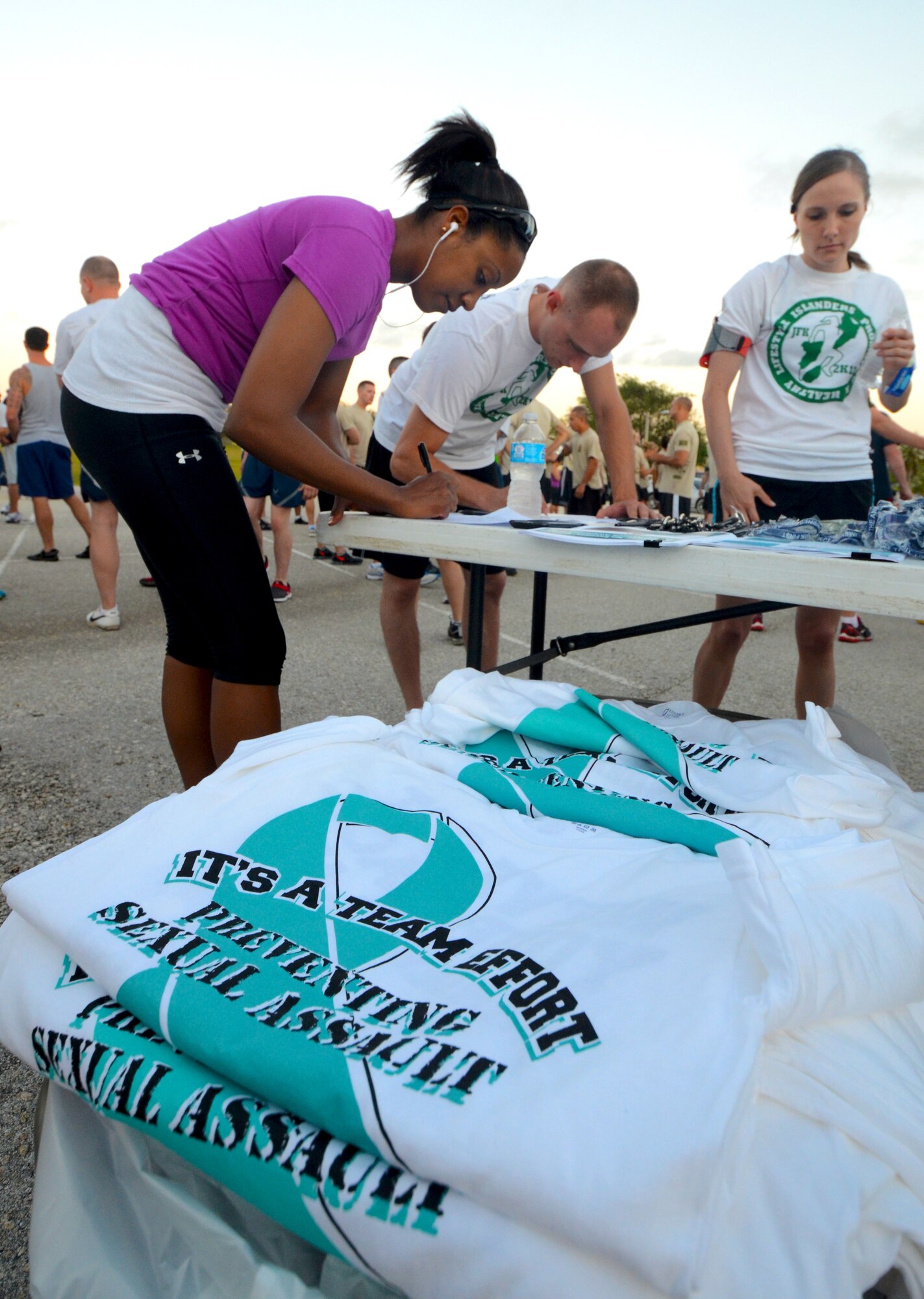 Members of Team Andersen sign up for the Sexual Assault Awareness Month 5K run on Andersen Air Force Base, Guam, April 3, 2013. The month of April is National Sexual Assault Awareness Month, and the 36th Wing has several events planned to show support in the fight against sexual assault. (U.S. Air Force photo by Senior Airman Benjamin Wiseman/Released)