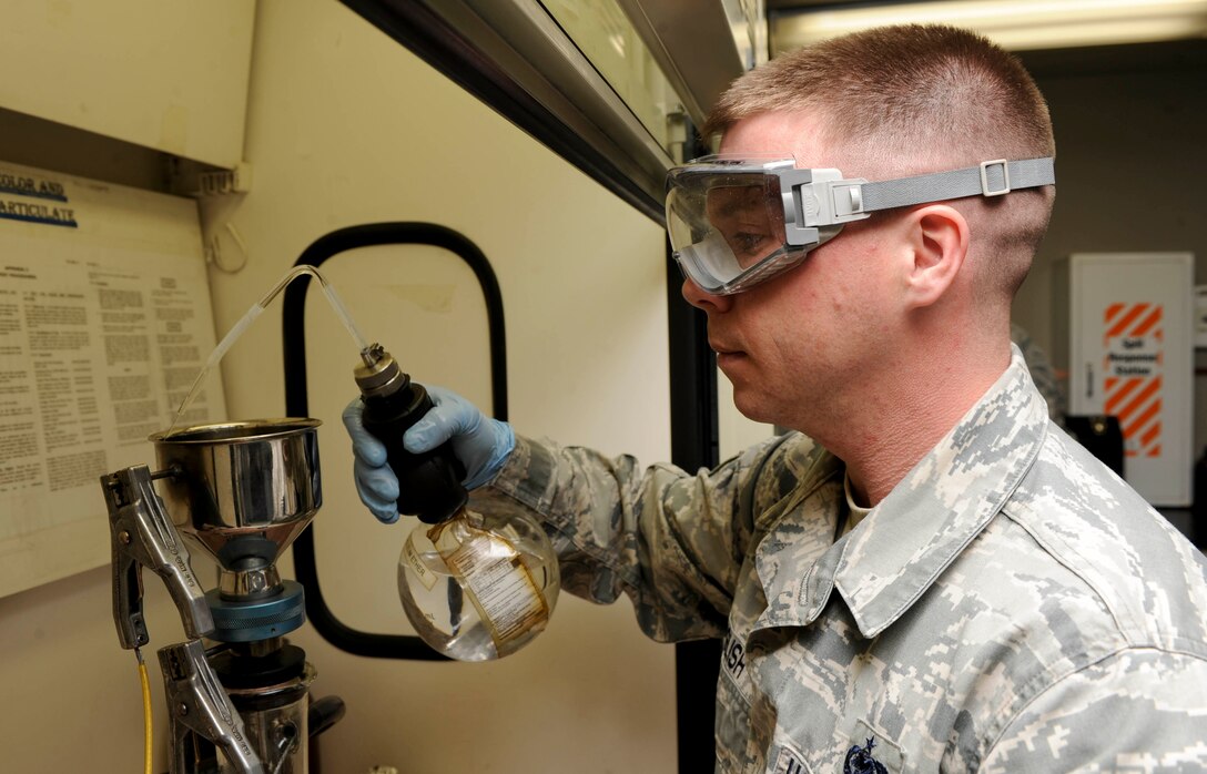 Staff Sgt. Dallas English, 28th Logistics Readiness Squadron fuels laboratory NCO in charge, measures filtration time and solids content during a jet fuel sample test at Ellsworth Air Force Base, S.D., March 26, 2013. This crucial process verifies that no contaminants are in the fuel, preventing damage to the engine. (U.S. Air Force photo by Airman 1st Class Anania Tekurio/Released) 