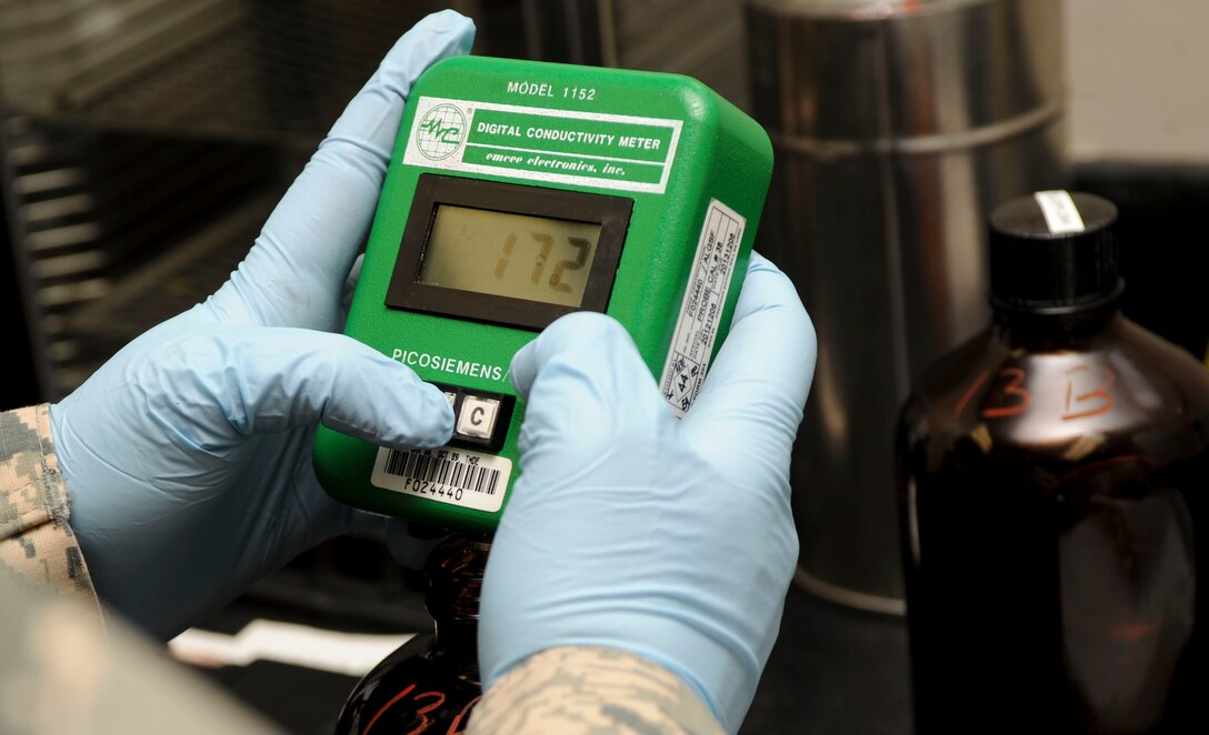 Senior Airman Bruce Hack, 28th Logistics Readiness Squadron fuels technician, uses a conductivity meter to measure the amount of static dissipater additives in a sample at the fuels lab at Ellsworth Air Force Base, S.D., March 26, 2013. Fuel must be free from static, which could lead to ignition and damage to an aircraft. (U.S. Air Force photo by Airman 1st Class Anania Tekurio/Released)