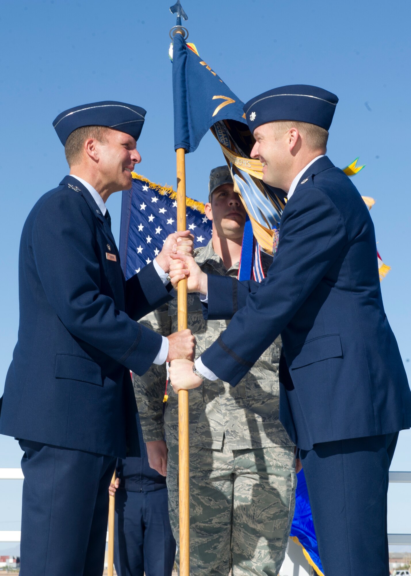 Lt. Col. Shawn Anger, 7th Fighter Squadron incoming commander, assumes command of the 7th FS from Col. Kenneth Johnson, 49th Operations Group commander during the change of command ceremony at Holloman Air Force, N.M., April 1. Anger has been the operations officer for the 7th FS and the 49th Operations Support Squadron since May 2011. (U.S. Air Force photo by Senior Airman DeAndre Curtiss/Released) 