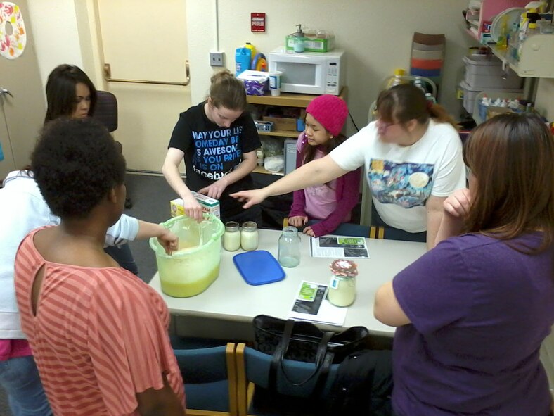 Stacie Collins, do-it-your-self instructor, points to the next ingredient used to create laundry detergent during a do-it-yourself event hosted March 29, 2013, at the Grand Forks Air Force Base Library. (U.S. Air Force photo/Staff Sgt. Luis Loza Gutierrez)

