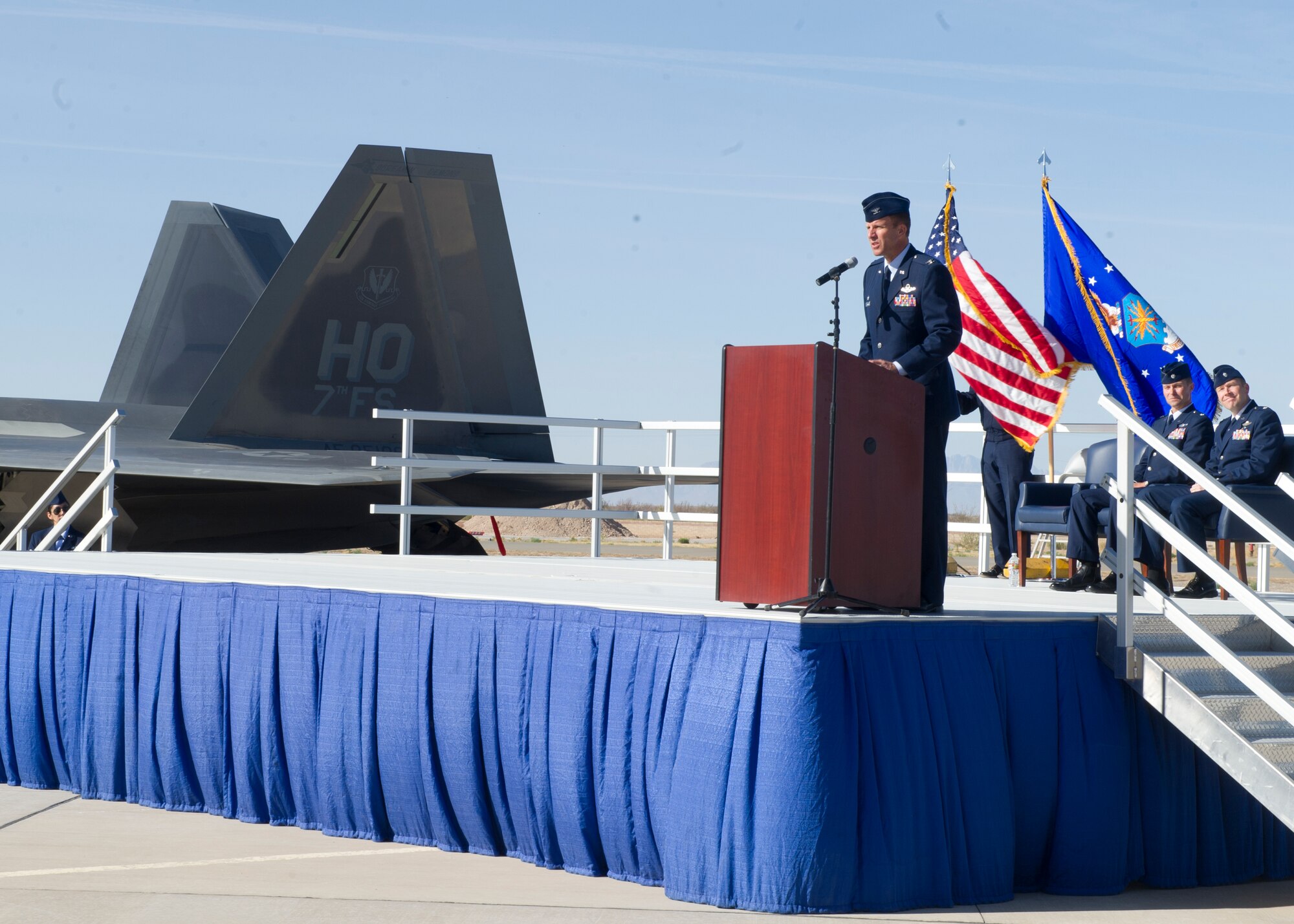 Colonel Kenneth Johnson, 49th Operations Group commander, addresses the crowd at the 7th Fighter Squadron change of command at Holloman Air Force Base, N.M., April 1. Johnson was the presiding officer for the ceremony that saw Lt. Col. Larry Broadwell relinquish command of the 7th FS to Lt. Col. Shawn Anger. Johnson spoke at length about the tremendous accomplishments of the 7th FS under the leadership of Broadwell and the excitement of Anger taking over command. (U.S. Air Force photo by Senior Airman DeAndre Curtiss/Released) 