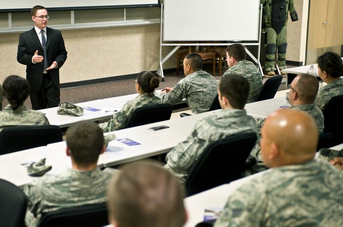 Mr. Josh Cooley , White House Communications Agency security manager, explains security clearance requirements during the WHCA recruiting brief March 26, 2013, at Nellis Air Force Base, Nev. The WHCA is looking for military members that are able to obtain a top secret security clearance, have no history of derogatory information and be able to serve in a Presidential support billet. (U.S. Air Force photo by Senior Airman Matthew Lancaster)