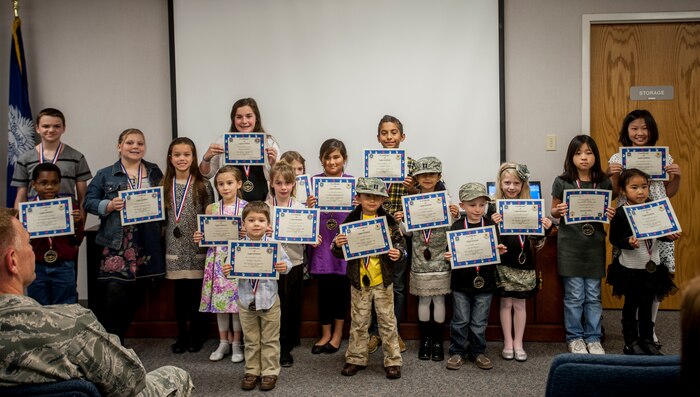 A “Little Heroes” ceremony was held at the Joint Base Charleston – Air Base Airmen and Family Readiness Center, March 27, 2013, to honor Team Charleston’s littlest heroes. Children (ages 4 to 12 years old) who recently experienced a deployment of a parent, were presented a certificate and medallion by Col. Richard McComb, JB Charleston commander. (U.S. Air Force photo / Airman 1st Class Tom Brading)