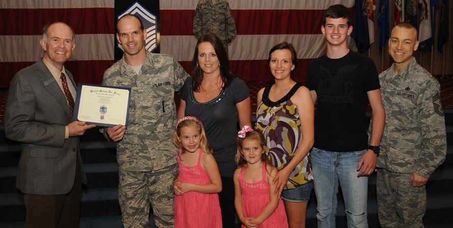 Master Sgt. Clinton Reed, Air Force Global Strike Command, receives a certificate of promotion to Senior Master Sgt. from Jeffrey Beene, Air Force Global Strike Command director of staff, during the March Wing Promotion Ceremony on Barksdale Air Force Base, La., April 1, 2013. (U.S. Air Force photo/Senior Airman Sean Martin)