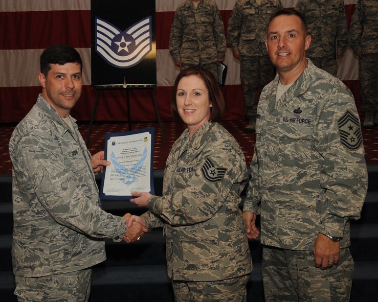Staff Sgt. Misty Southerland, 2nd Medical Operations Squadron, receives a certificate of promotion to Tech. Sgt. from Col. Andrew Gebara, 2nd Bomb Wing commander, during the March Wing Promotion Ceremony on Barksdale Air Force Base, La., April 1, 2013. (U.S. Air Force photo/Senior Airman Sean Martin)